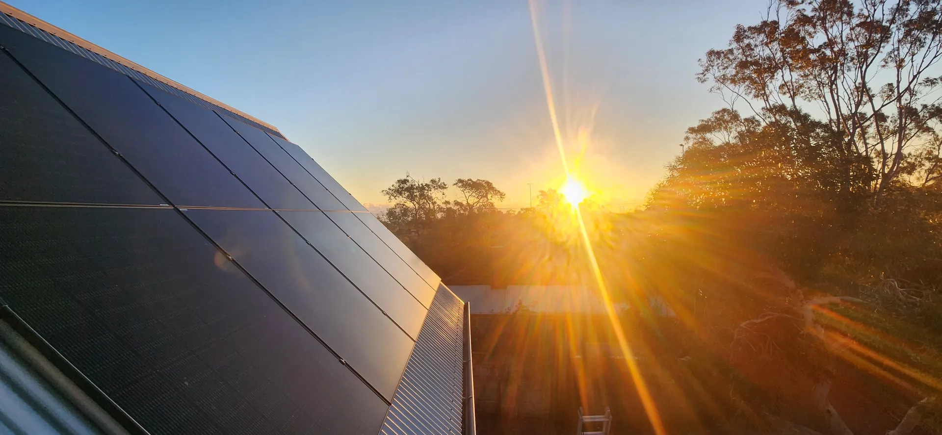 Rooftop solar panels installed by Unisol at sunset in the Perth area